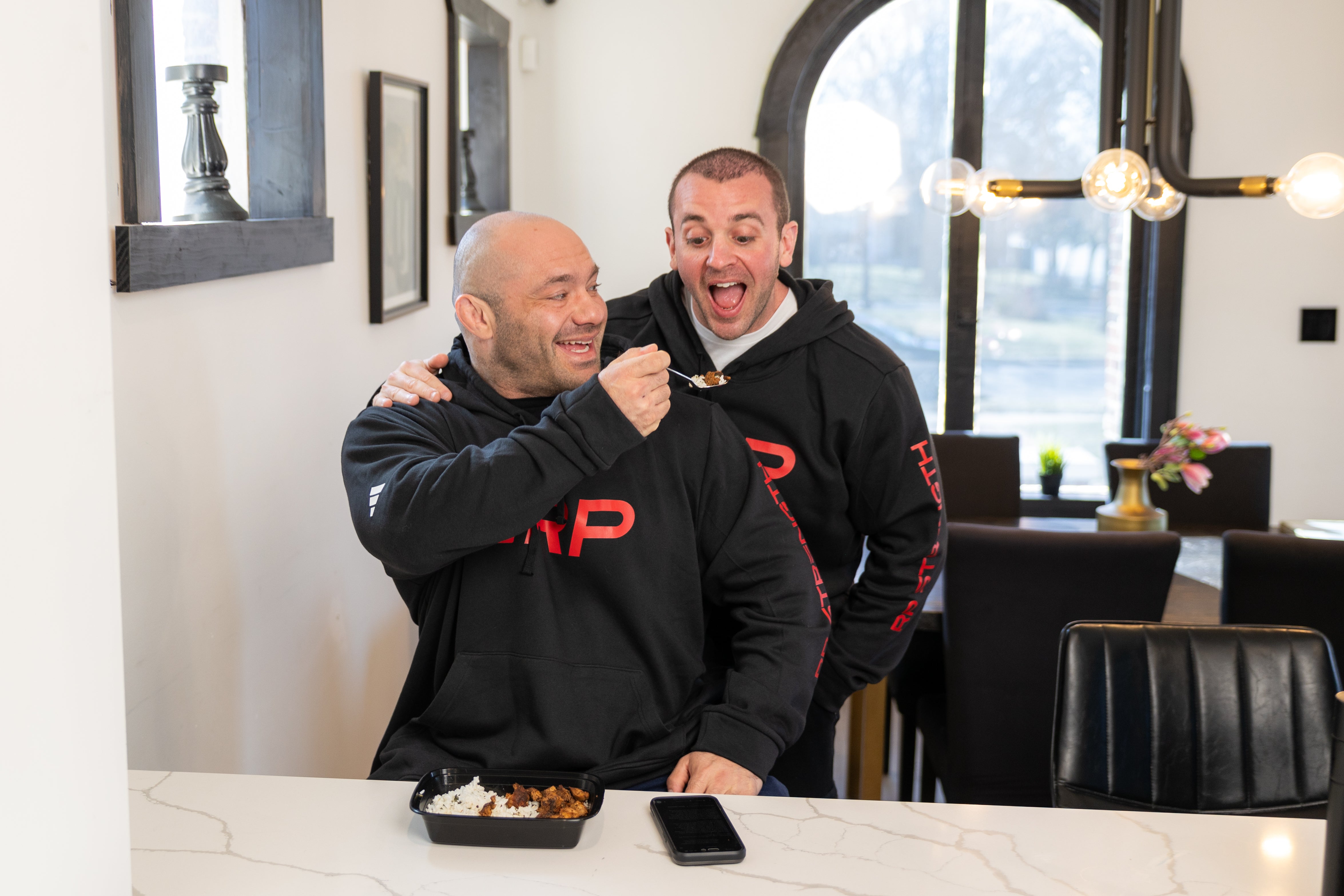 Dr. Mike feeding IFBB Pro Nick Shaw. Nutrition is key!